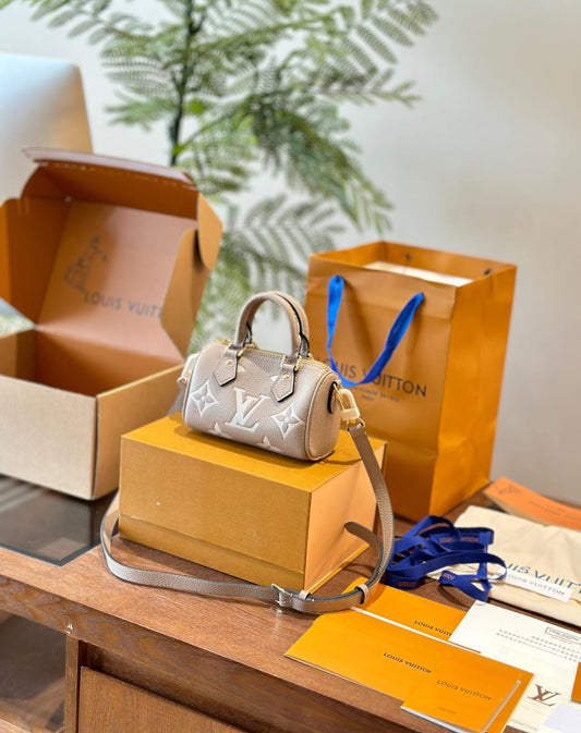 Louis Vuitton Nano Speedy Monogram Empreinte handbag in a tourterelle gray and creaam colour
