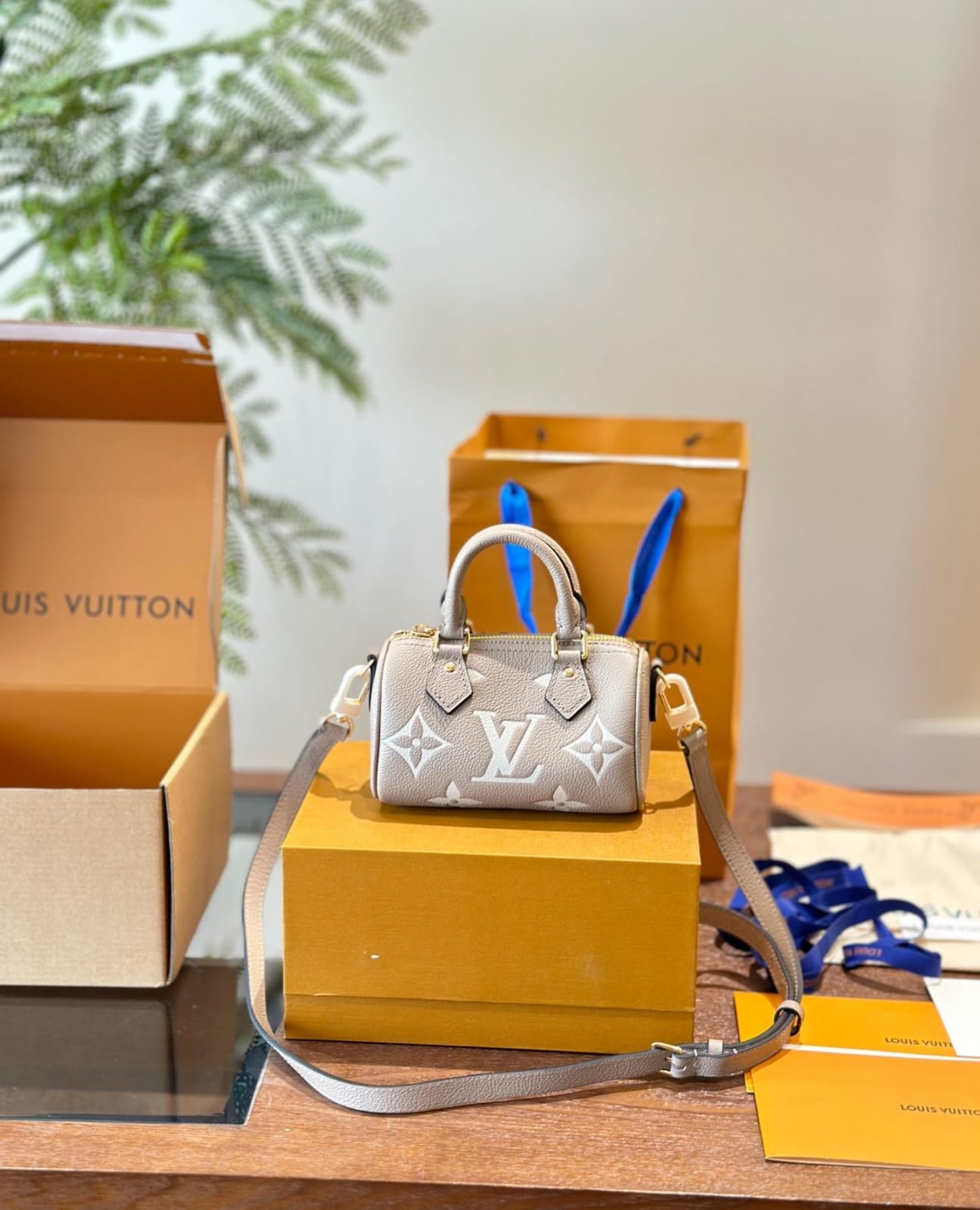 Louis Vuitton Nano Speedy Monogram Empreinte handbag in a tourterelle gray and creaam colour