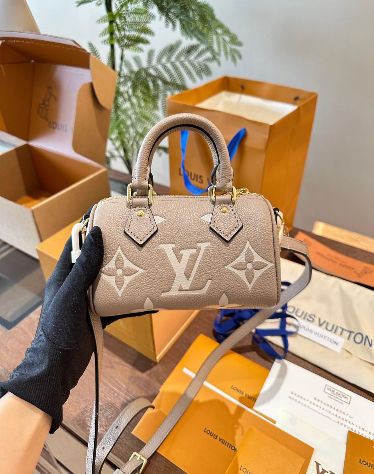 Louis Vuitton Nano Speedy Monogram Empreinte handbag in a tourterelle gray and creaam colour