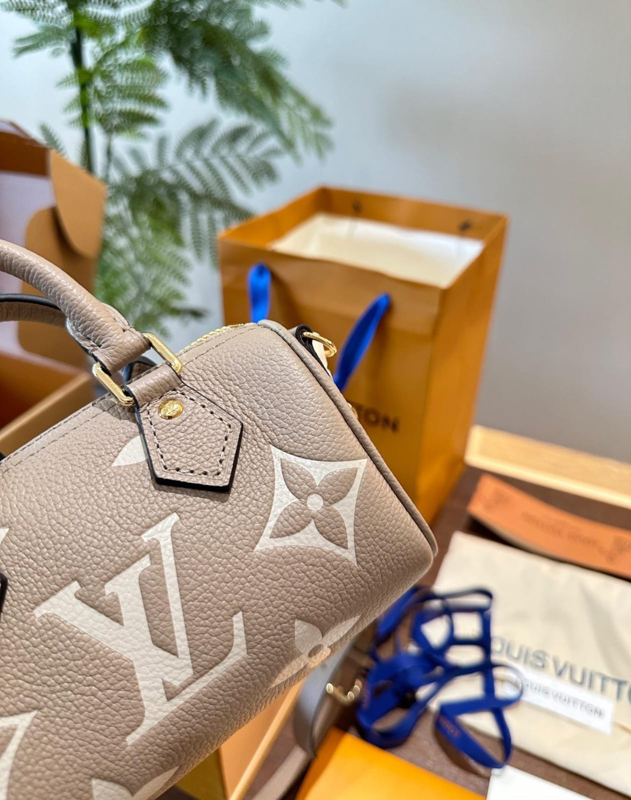 Louis Vuitton Nano Speedy Monogram Empreinte handbag in a tourterelle gray and creaam colour