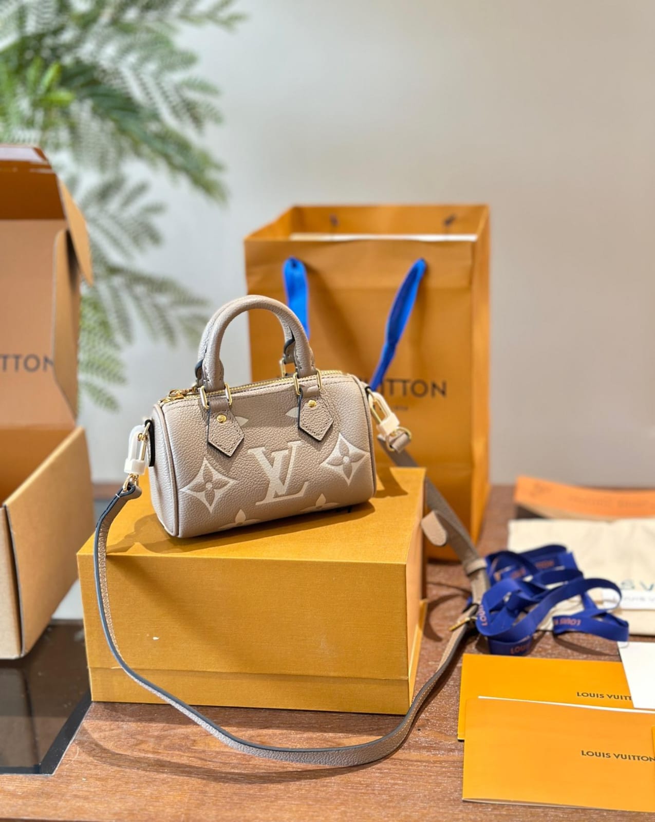 Louis Vuitton Nano Speedy Monogram Empreinte handbag in a tourterelle gray and creaam colour