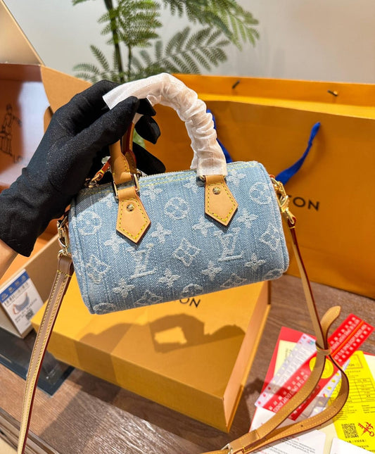 Louis Vuitton Nano Speedy handbag in sky blue Monogram Denim with vachetta leather trim and gold hardware