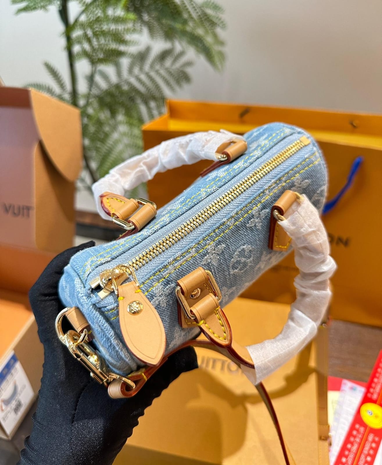 Louis Vuitton Nano Speedy handbag in sky blue Monogram Denim with vachetta leather trim and gold hardware
