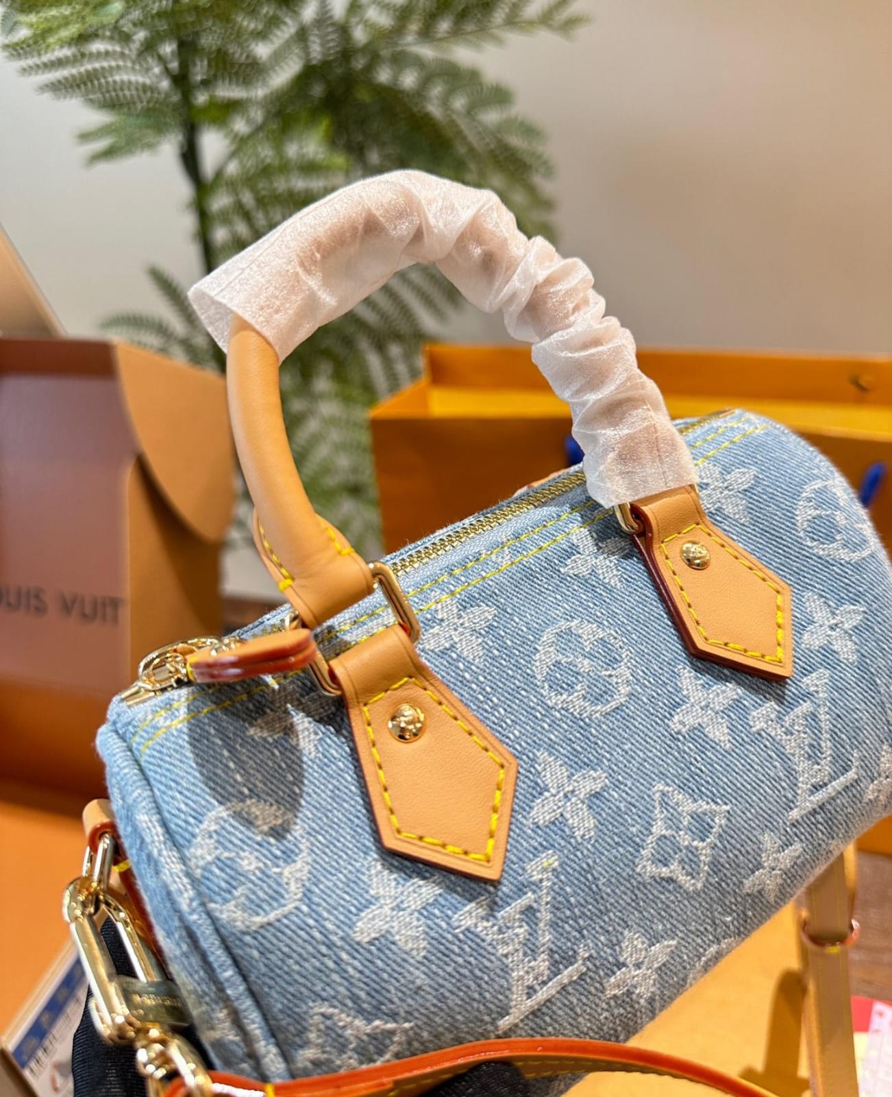 Louis Vuitton Nano Speedy handbag in sky blue Monogram Denim with vachetta leather trim and gold hardware