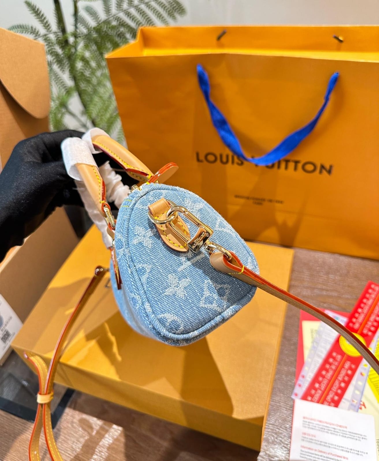Louis Vuitton Nano Speedy handbag in sky blue Monogram Denim with vachetta leather trim and gold hardware