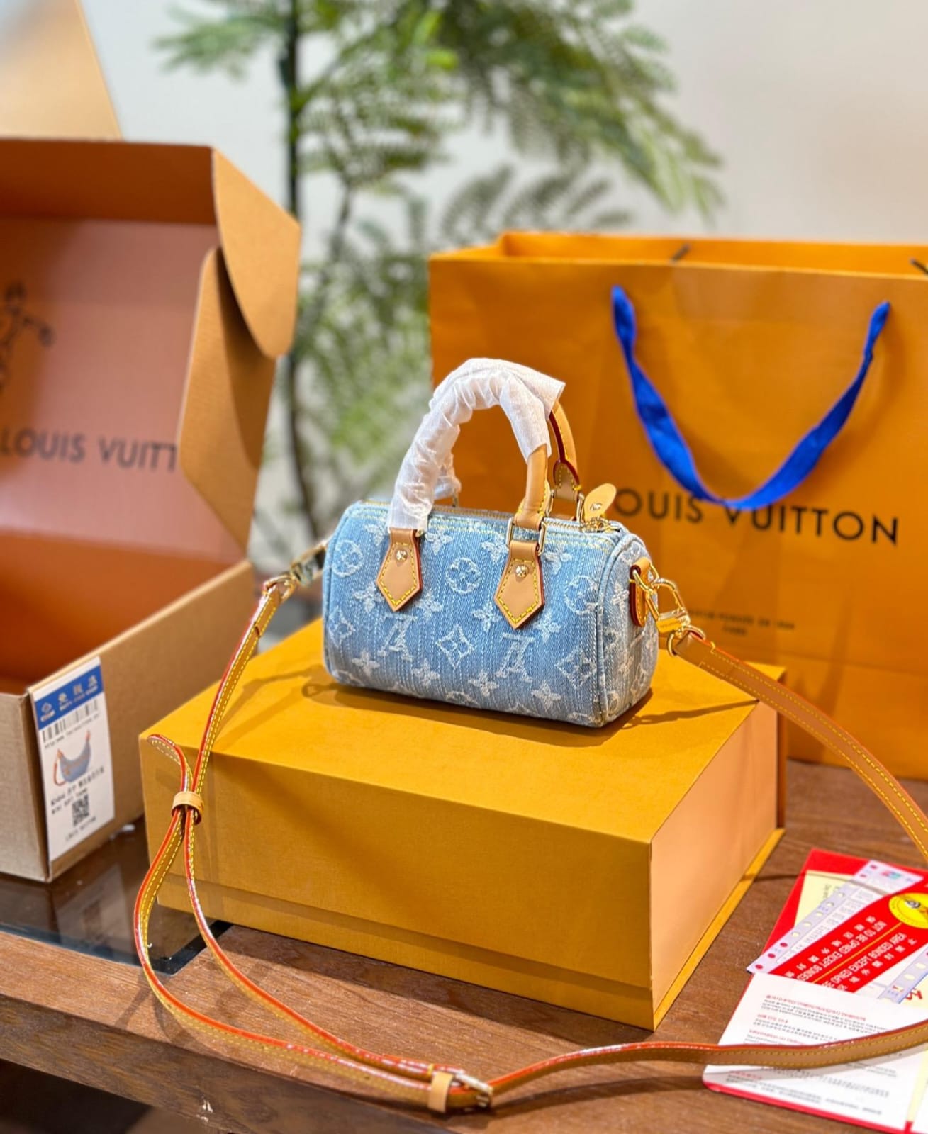 Louis Vuitton Nano Speedy handbag in sky blue Monogram Denim with vachetta leather trim and gold hardware