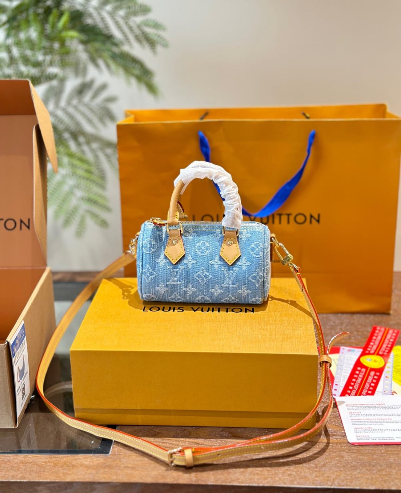 Louis Vuitton Nano Speedy handbag in sky blue Monogram Denim with vachetta leather trim and gold hardware