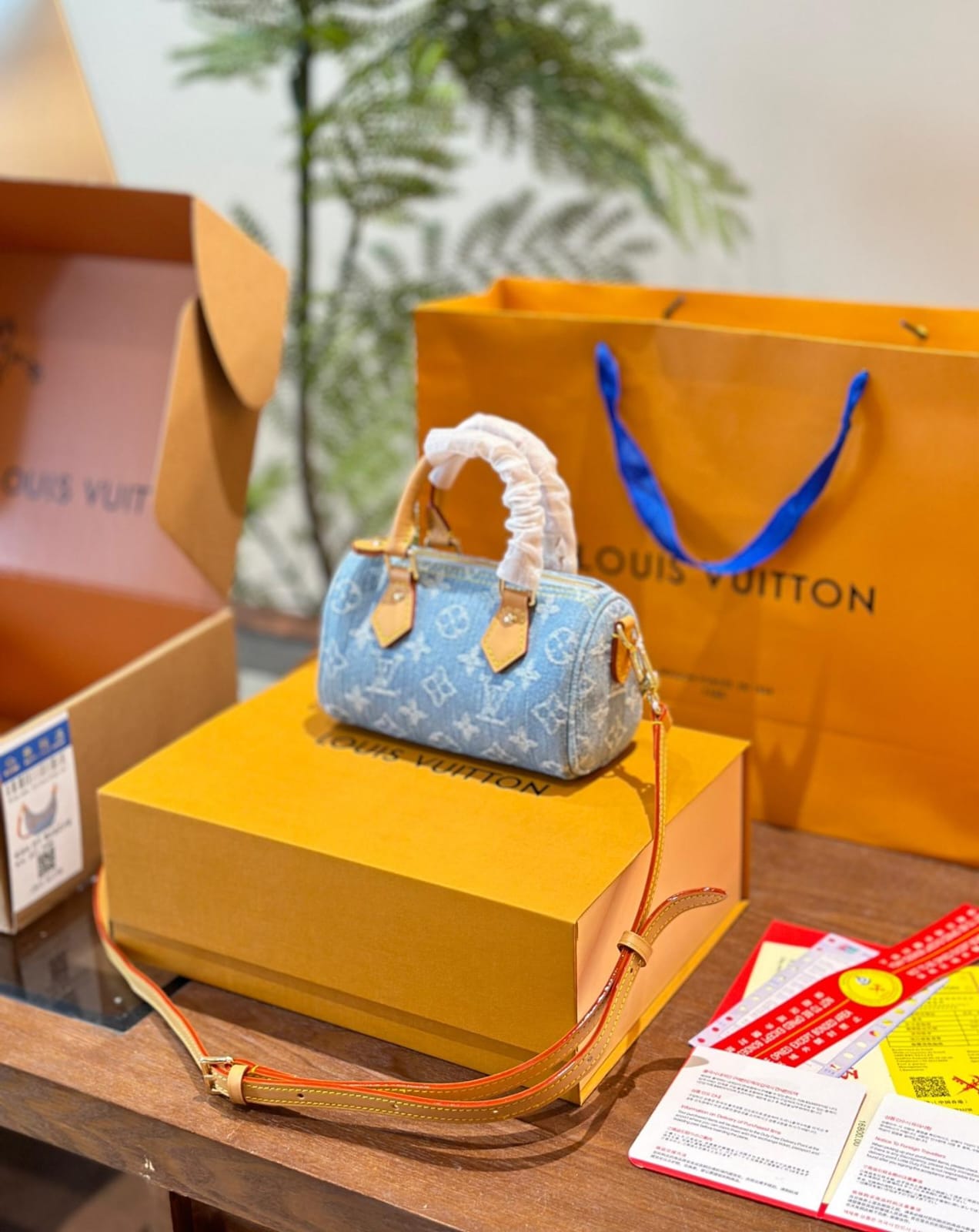Louis Vuitton Nano Speedy handbag in sky blue Monogram Denim with vachetta leather trim and gold hardware