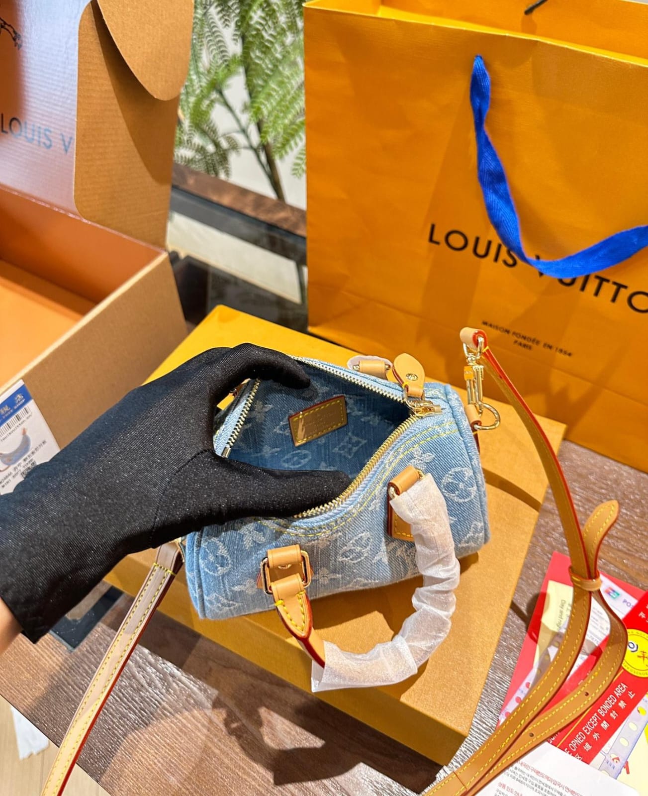Louis Vuitton Nano Speedy handbag in sky blue Monogram Denim with vachetta leather trim and gold hardware
