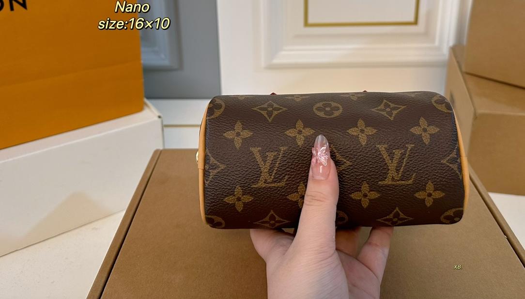 Louis Vuitton Nano Speedy handbag in Monogram coated canvas with natural cowhide leather trim and gold tone hardware (size 16×10)