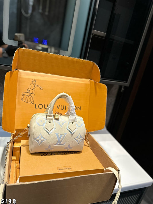 Louis Vuitton Monogram Empreinte Bicolour Speedy Bandoulière 20 handbag in white and blue leather.